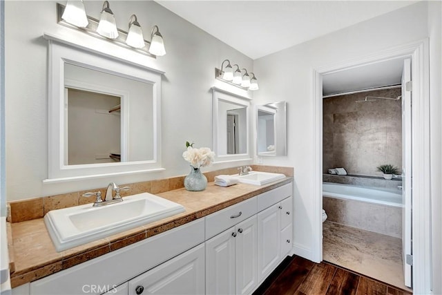 bathroom featuring vanity and hardwood / wood-style floors