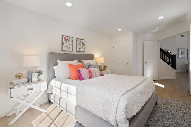 bedroom featuring light hardwood / wood-style floors