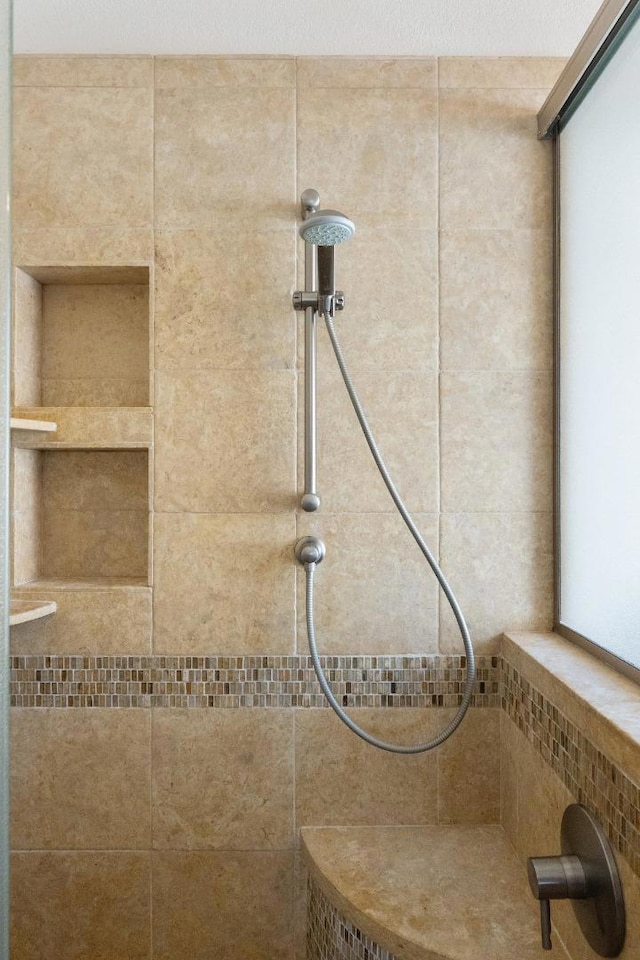 details featuring a tile shower