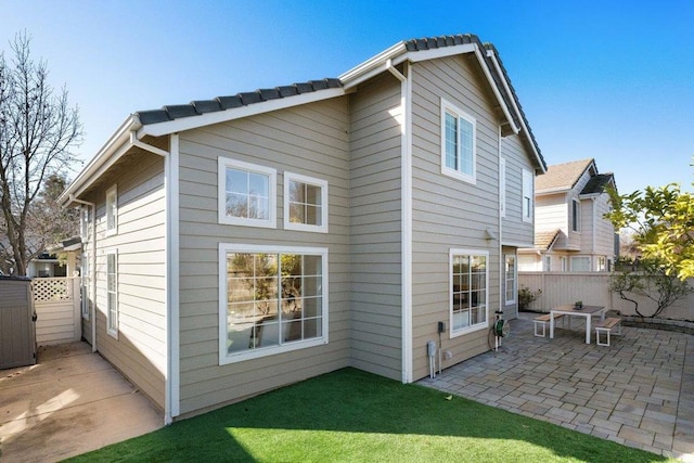 rear view of property featuring a patio area