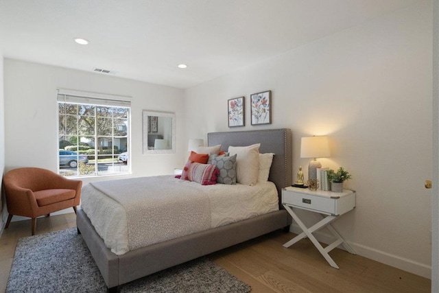 bedroom with wood-type flooring