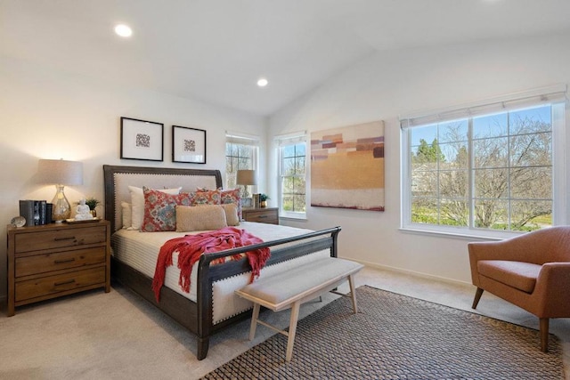 carpeted bedroom with lofted ceiling