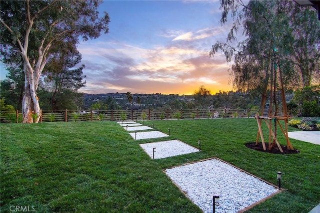 view of yard at dusk