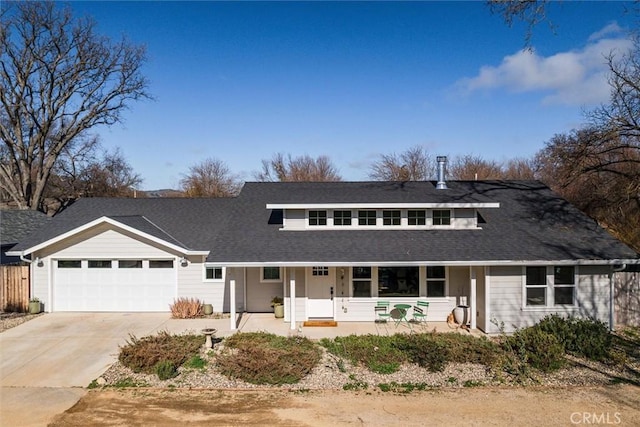 view of front of home featuring a garage and a porch