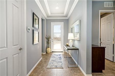 doorway to outside featuring crown molding and light tile patterned flooring