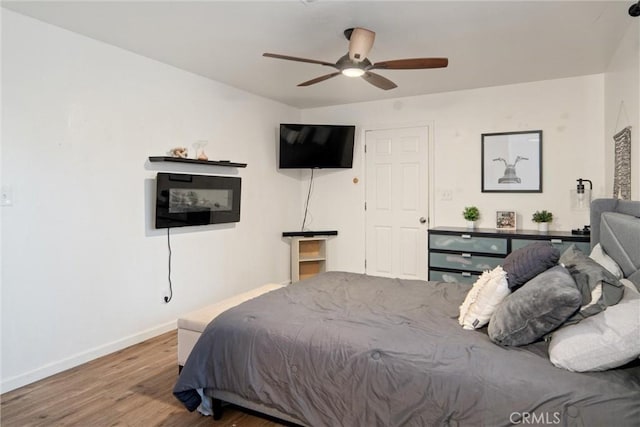 bedroom featuring ceiling fan and hardwood / wood-style floors