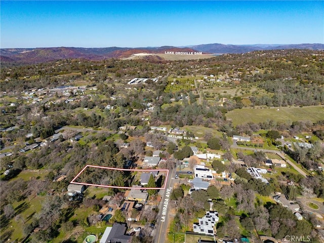 birds eye view of property featuring a mountain view