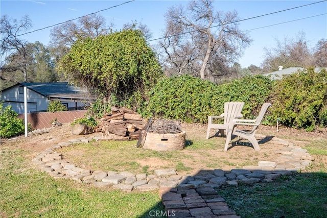 view of yard with an outdoor fire pit