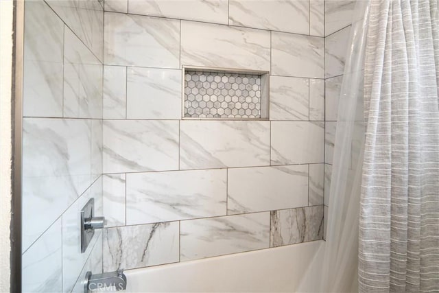 bathroom with shower / tub combo