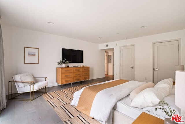 bedroom with wood-type flooring