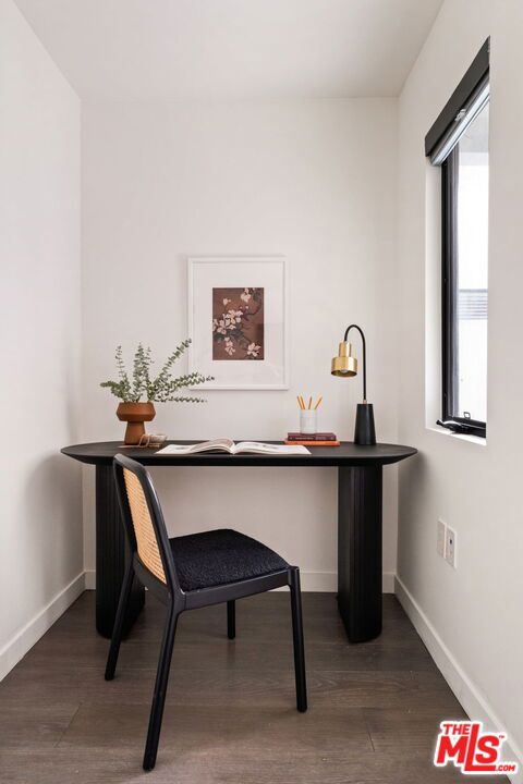 office with dark wood-type flooring