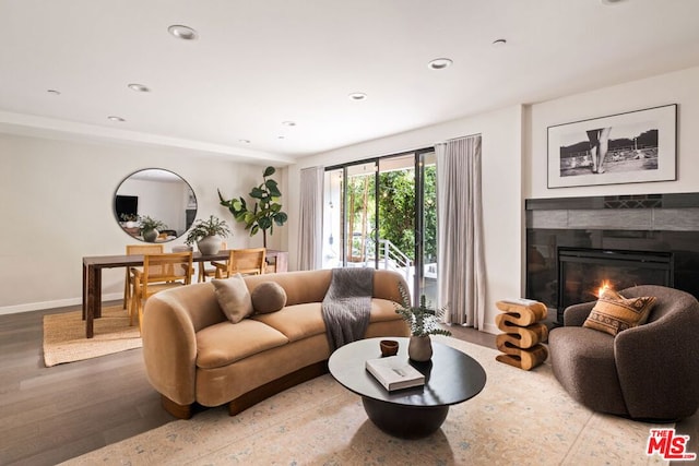 living room featuring hardwood / wood-style flooring and a fireplace