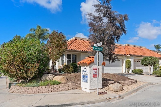 mediterranean / spanish-style house featuring a garage