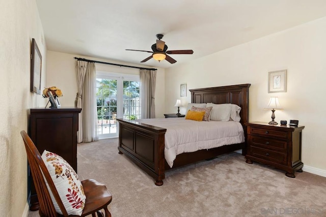 carpeted bedroom with access to outside and ceiling fan