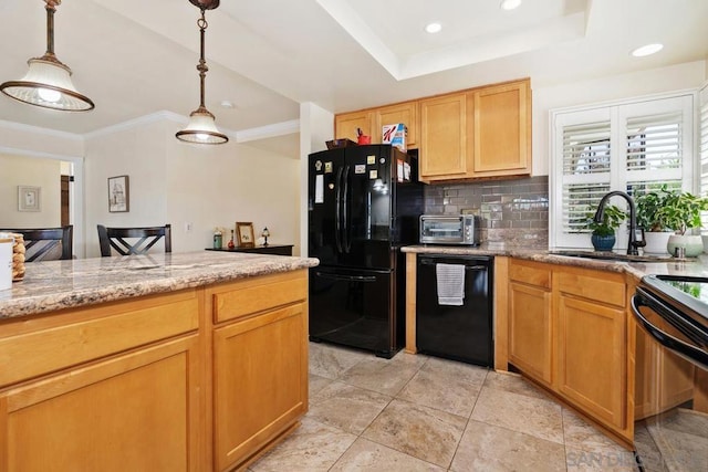 kitchen with sink, tasteful backsplash, light stone countertops, black appliances, and decorative light fixtures