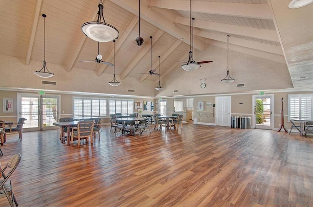 miscellaneous room with wood-type flooring, high vaulted ceiling, and beam ceiling