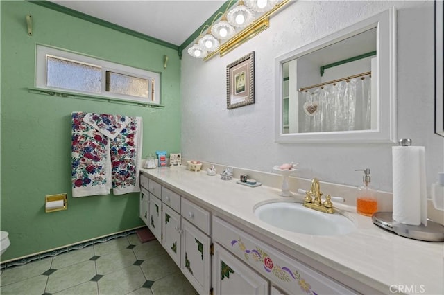 bathroom featuring vanity and crown molding