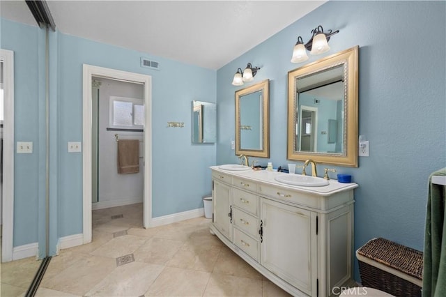 bathroom with vanity and tile patterned floors