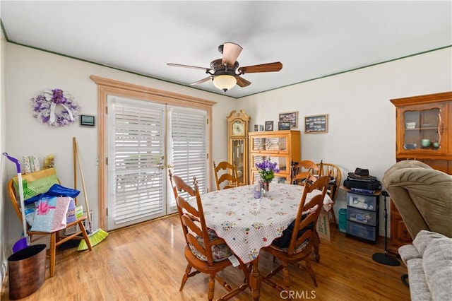 dining space featuring ceiling fan and light hardwood / wood-style floors