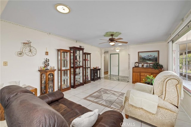 tiled living room with ceiling fan