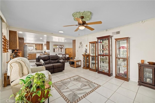 living room featuring ceiling fan and light tile patterned floors