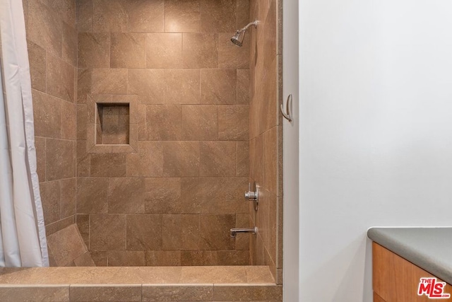 bathroom featuring a shower with curtain