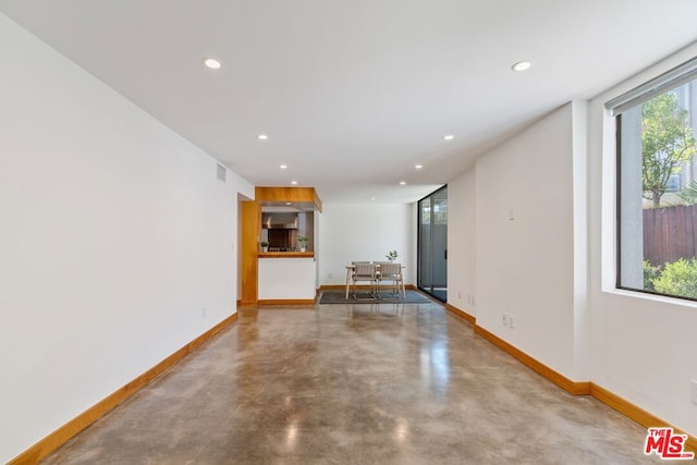 spare room with concrete flooring