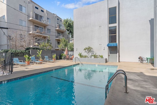 view of swimming pool featuring a patio