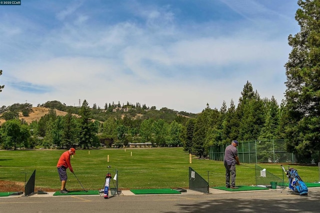 view of property's community with a yard