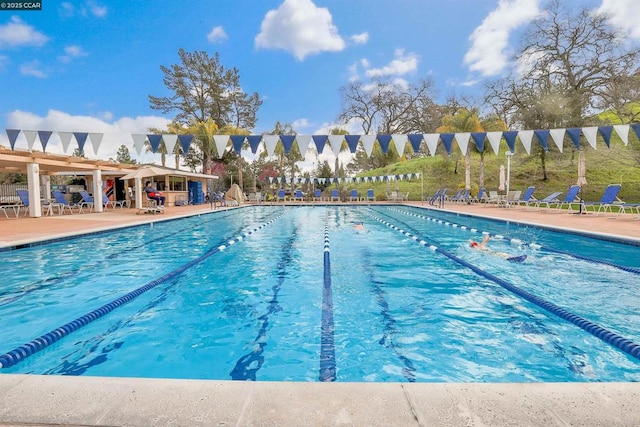 view of swimming pool featuring a patio area