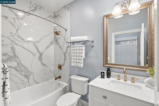 full bathroom featuring tiled shower / bath, vanity, and toilet