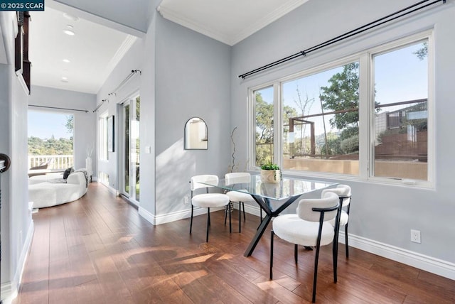 dining area with dark wood-type flooring and ornamental molding