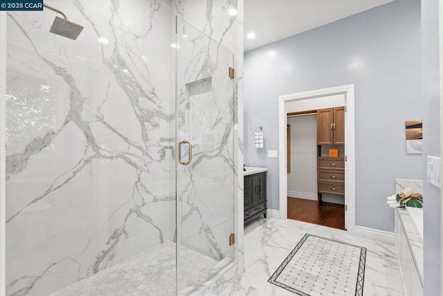 bathroom featuring vanity and an enclosed shower