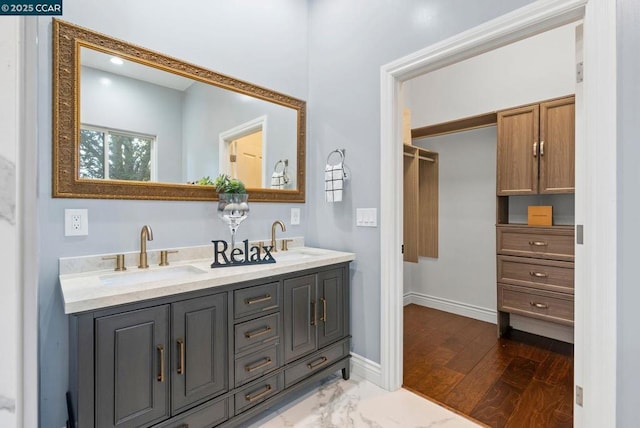 bathroom with vanity and wood-type flooring