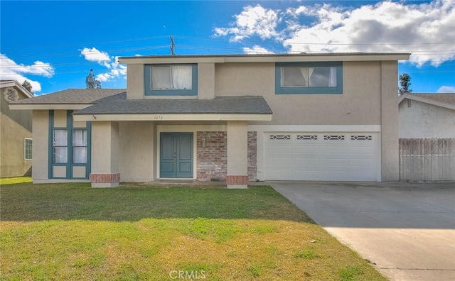 view of front of house with a garage and a front lawn