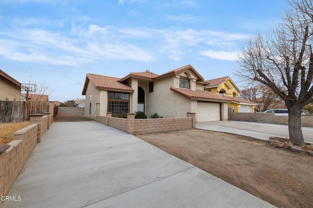 mediterranean / spanish-style home featuring a garage