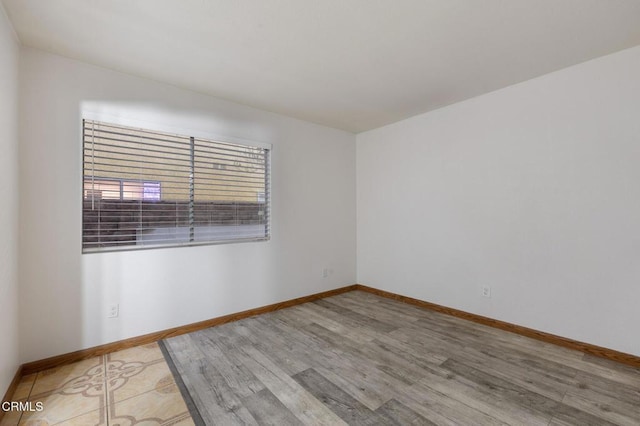 unfurnished room featuring light wood-type flooring