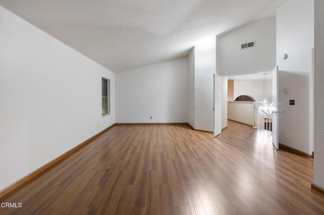 interior space featuring hardwood / wood-style flooring and vaulted ceiling