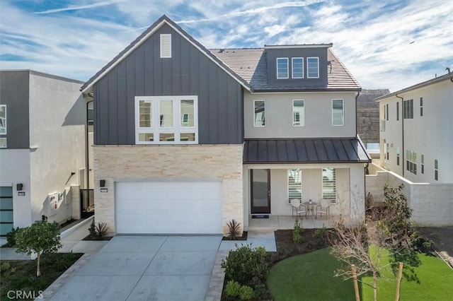 view of front of home with a garage and a front lawn