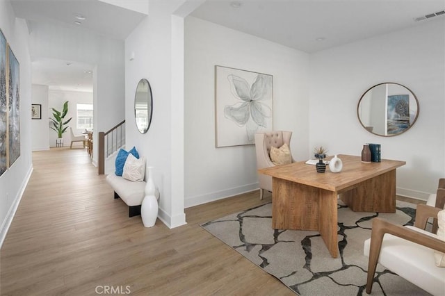 office space with light hardwood / wood-style flooring