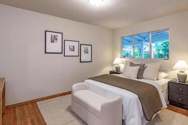 bedroom with light hardwood / wood-style flooring