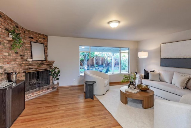 living room featuring a fireplace and light hardwood / wood-style floors