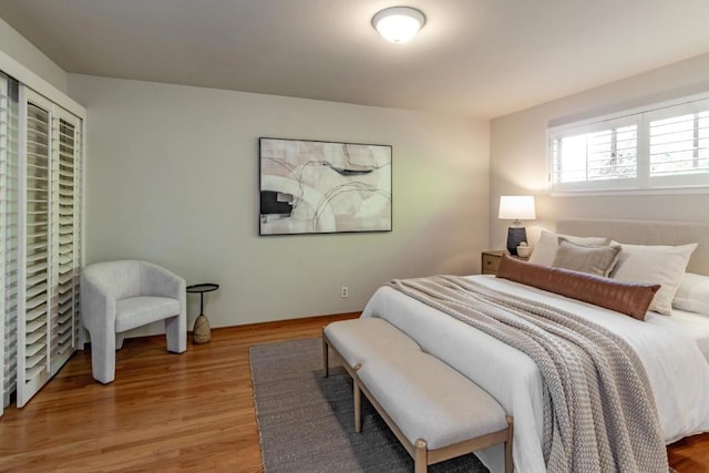 bedroom with hardwood / wood-style floors