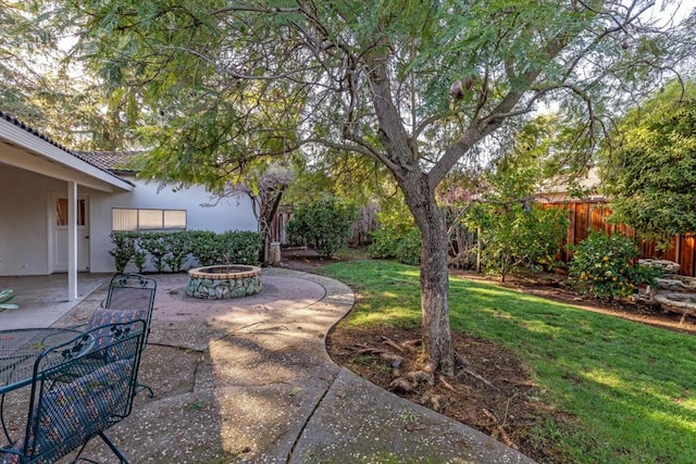 view of yard featuring a patio area and a fire pit