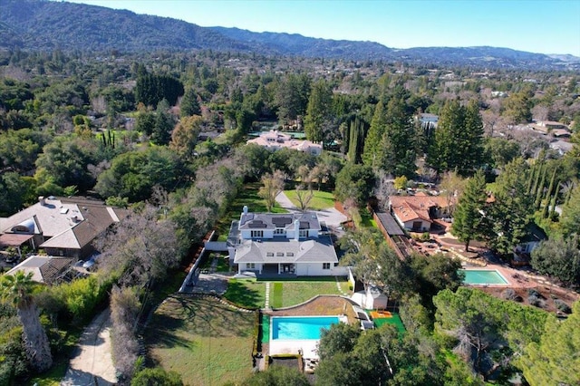 birds eye view of property featuring a mountain view