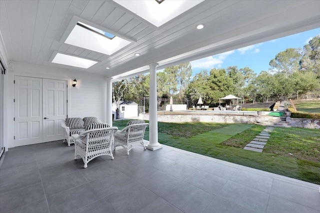 view of patio / terrace with a storage unit