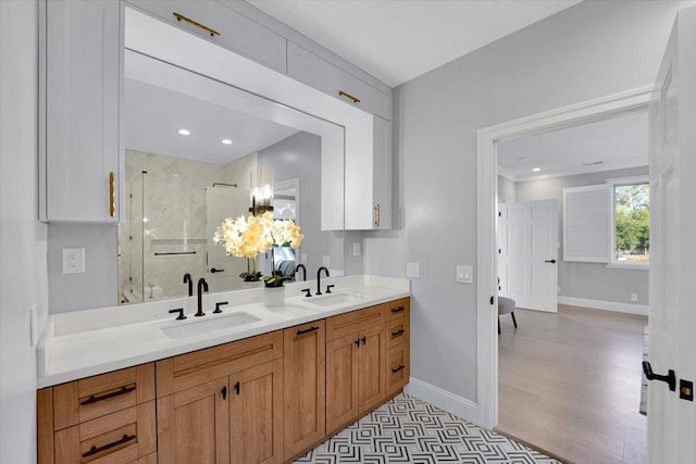 bathroom with vanity and an enclosed shower