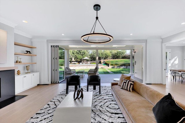 living room featuring crown molding and light wood-type flooring