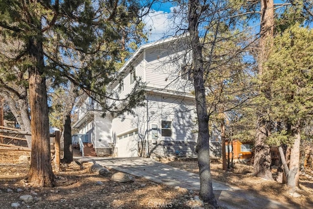 view of side of home with a garage