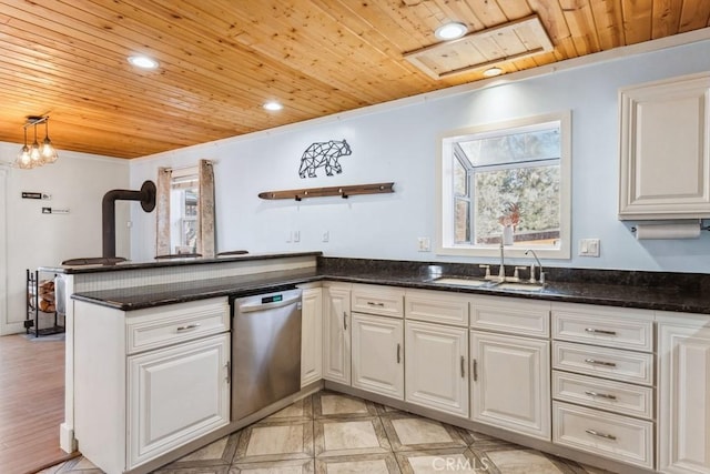 kitchen featuring white cabinetry, sink, a wealth of natural light, and stainless steel dishwasher